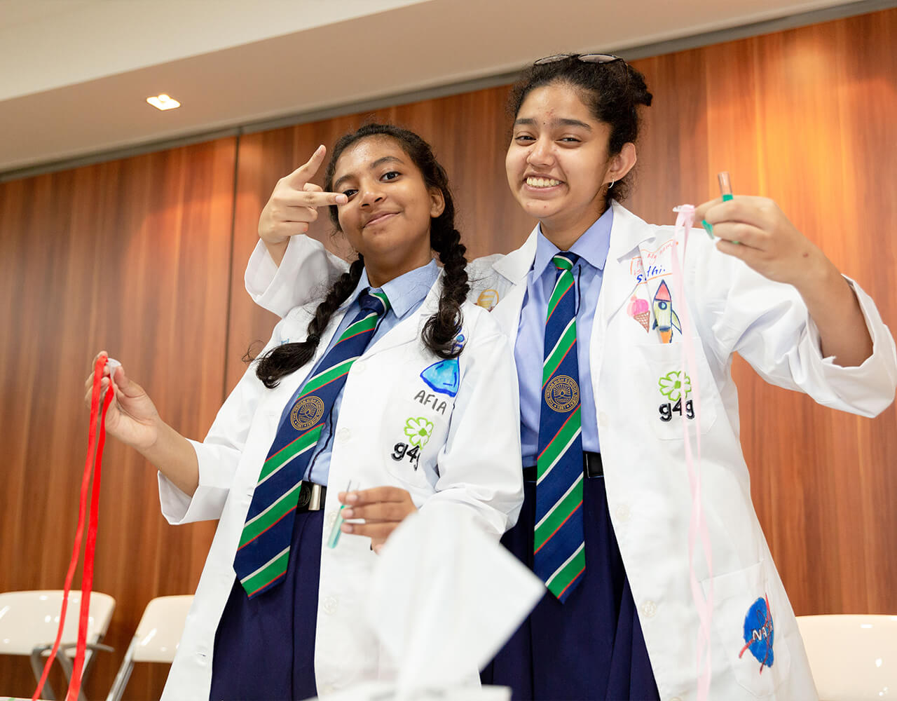 2 school students posing for a picture at the Green Light for Girls event in Dubai Science Park